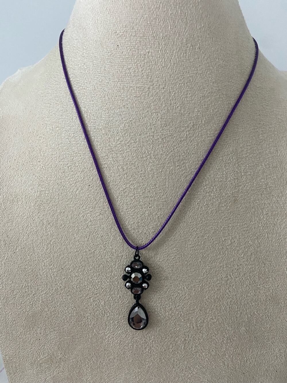 black pendant with gray rhinestone